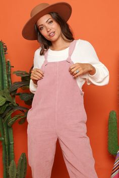 This cute corduroy jumpsuit is so soft and comfy. It features side pockets, button sides, straight legs, and knotted straps. This jumpsuit looks great paired with one of our long sleeve sweaters. Dusty Pink Color Fits true to size Made in the USA Casual Corduroy Overalls For Fall, Trendy Cotton Overalls For Loungewear, Casual Fall Corduroy Overalls, Fall Cotton Overalls For Loungewear, Casual Pink Jumpsuits And Rompers For Fall, Casual Spring Corduroy Overalls, Casual Pink Overall Shortalls, Casual Pink Cotton Shortalls, Pink Cotton Casual Shortalls