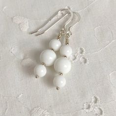 "Pretty White Agate three drop earrings in sterling.  Lightweight Boho White dangle earrings for Summer in bright white.   These agate earrings are lightweight and flirty, with graduated sizes of beads dangling beneath.  All swaying from sterling silver ear wires.  1 3/4\" long from the top of the ear wires to the bottom of the longest dangle; and 1/4\" wide at the widest point.  Your earrings will be made just for you and sent to you in a pretty gift box.  Also available in sterling silver leve Earrings For Summer, Agate Earrings, White Agate, Pretty Gift, White Earrings, Dangle Charms, Etsy Earrings Dangle, Beaded Dangles, Ear Wires