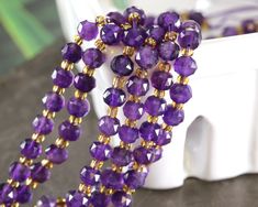 the beads are purple and gold in color