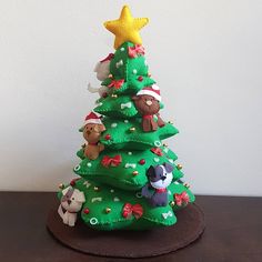 a small christmas tree with animals on it