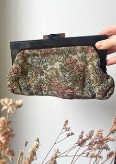 Vintage Mid Century 1960s/ 1970s Floral Tapestry Clutch bag. Beautiful floral motif.  In good Vintage condition. Has one small mark on the outside of the bag (see pictured) and some slight wear to the plastic and lining due to age.  This is a used Vintage item which has been loved, cherished and will show signs of wear and tear. Please ensure you have read description and viewed images thoroughly before purchasing. Any questions please feel free to send over a message. PLEASE NOTE : All items in our store are vintage and used. We try to picture and state any discrepancies on the items but due to the vintage nature of the pieces sometimes small marks/ holes can get missed. Please take this into account when purchasing an item. Floral Tapestry, Vintage 1960s, Clutch Handbag, Floral Motif, Evening Bags, Purses And Handbags, Clutch Bag, 1970s, 1960s