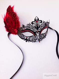 Filigree mask painted in black, embellished with Rhinestones and adorned with feathers. S H I P P I N G - Processed same day or within 24 hours. 1-2 day guaranteed delivery services offered, add items to cart and click on shipping tab for rates. Pls leave a check out note with your need date & contact number (especially for expedited and custom orders) Msg for delivery time frames (Include your state/country). S I Z E Measures approx. 9 inches in length, 4 inches in Width from forehead to no Masquerade Quinceanera Ideas, Red Masquerade Mask, Red Masquerade, Prom Mask, Couples Masquerade Masks, Prom 23, Quincenera Dresses, Masquerade Ball Mask, Metal Mask