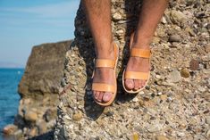 "Super fast 1-4 days delivery to the US and Europe with DHL express shipping available at checkout! Please add a note with your phone number at checkout. Mens leather sandals made by 100% genuine leather. Greek leather sandals. Open toe with two wide pararell straps, with adjustable ankle strap. Unisex sandals , suitable for both women and men. Non- slip rubber sole. Handcrafted in Greece. Natural tan color. Please note that the color of the sandal will eventually get darker over time. Also, due Natural Leather Sandals For Everyday, Everyday Natural Leather Sandals, Jesus Sandals, Mens Shoes Sandals, Men Sandals, Leather Ideas, Mens Leather Sandals, Handmade Sandals, Tan Sandals