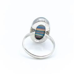 Sterling Silver Rainbow Calsilica Ring Size 9. This Sterling Silver ring features one large oval Rainbow Calsilica cabochon with beautiful colors. A man-made material that makes a great conversation piece. Ring is pre-owned and in great condition. Buy with confidence knowing that all precious metals are tested and are guaranteed with the Thermo Scientific Niton DXL Xray Scanner. All gemstones are authenticated using the Presidium Gem Tester II. Jewelry items come in a black velvet jewelry pouch Multicolor Cabochon Rings For Anniversary, Multicolor Polished Rings Perfect As Gift, Multicolor Polished Rings As A Gift, Unique Multicolor Rings With Polished Finish, Multicolor Oval Opal Ring For Formal Occasions, Oval Multicolor Rings For Collectors, Multicolor Polished Finish Rings For Gift, Multicolor Polished Rings For Gifts, Unique Oval Collectible Rings