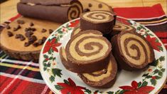 several pieces of chocolate christmas roll on a plate