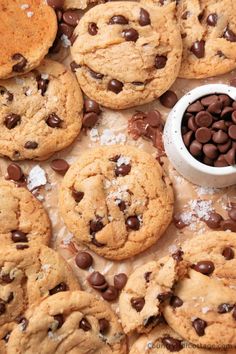 cookies and chocolate chips are arranged on a table