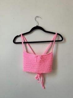 Available in white and pink! The back of this top is adjustable, so it can fit a range of sizes, but works best for a size medium. Pink Cotton Tank Top For Vacation, Fitted Pink Crochet Crop Top, Pink Crop Top Tank For Summer, Pink Cropped Cotton Crop Top, Pink Cropped Tank Top For Spring, Pink Fitted Crop Top Tank, Pink Cropped Cotton Top, Pink Stretch Summer Tank Top, Pink Stretch Tank Top For Summer