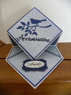 an anniversary card with a bird sitting on it's side and the word, anniver