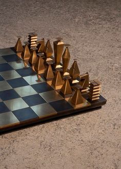 a chess board with golden pieces on it