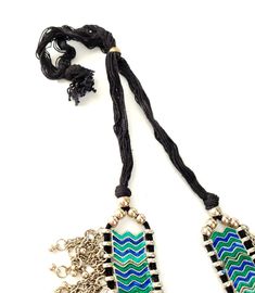 Turn heads wearing this striking Afghani tribal necklace in colorful enamel meena work with long metal fringe tassels. It drapes beautifully! The enamel shines and glistens, as if wet. The fringe is so pretty! Crescent moon pendant. This is a substantial, heavy piece. Weighs 6.5 ounces or 179 gm. Adjustable length of 9 to 15 inches, using sliding bead on black cotton threads, ensures a perfect fit for you. Pendant measures 2 3/4 x 1 3/4 inches. Shop more necklaces here: https://www.etsy.com/shop Unique Meenakari Necklaces For Festivals, Silver Meenakari Beaded Necklaces For Festive Occasions, Navratri Multicolor Necklaces With Motifs, Bohemian Handloom Necklaces For Festivals, Traditional Mirror Work Choker Necklace, Festive Motif Necklaces, Bohemian Meenakari Necklace For Navratri, Festive Motif Necklace, Festive Bohemian Meenakari Necklace