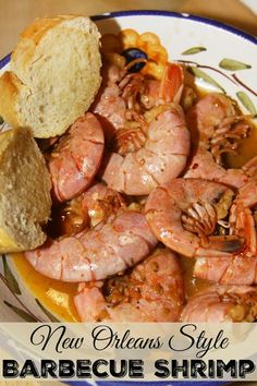 a close up of a plate of food with shrimp and bread on the side, text reads new orleans style barbecue shrimp