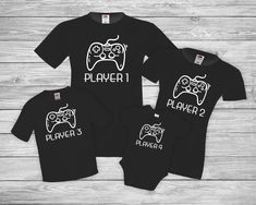 Valentines day gift Player 1 Player 2 Shirt | Player 3 Tshirt | Family gaming shirts | Gaming night shirts Joystick tshirt Gamer T-shirt Father and son outfitPlayer 1 Player 2 Shirt | Player 3 Tshirt | Family gaming shirts | Gaming night shirts Joystick tshirt Gamer T-shirt Father and son outfit Family matching shirt | Gaming night shirts | Joystick | Player 1 Player 2 Player 3 Shirt | Gamer T-shirt | Father and son outfit Here are MUGS wih the same designs:  https://www.etsy.com/listing/7846073 Black Gamer T-shirt With Letter Print, Black Short Sleeve Gamer Tops, Black Gamer Top With Screen Print, Black Cotton T-shirt For Gaming Events, Gamer Tops With Letter Print, Black Gamer Tops With Logo Print, Black Gamer Top With Funny Text, Black Gamer T-shirt With Funny Text, Papa Baby