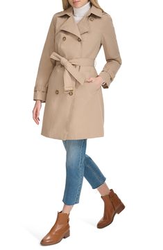 The ultimate all-season coat, this water-resistant trench has all the elements you want—a removable hood, an optional belt and a classic double-breasted silhouette. 37" length (size Medium) Double-breasted button closure Removable hood Belted cuffs Removable belt Front slant pockets Water resistant Lined, with polyester fill 100% polyester Machine wash, tumble dry Imported A Line Trench Coat, Weatherproof Outerwear For Spring Workwear, Weatherproof Outerwear For Work In Spring, Weatherproof Spring Outerwear For Work, Spring Weatherproof Outerwear For Work, Belted Raincoat For Fall, Winter Gabardine Raincoat With Long Sleeves, Winter Gabardine Raincoat, Solid Weatherproof Outerwear For Spring