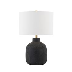 a black table lamp with a white shade