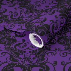 a purple and black wallpaper with an intricate design on the background, it is very dark