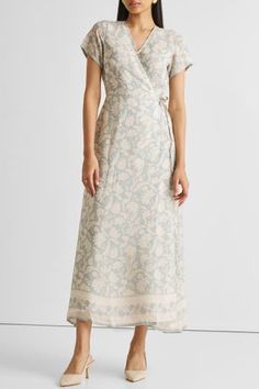 Unveil elegance with our 'Maxi Wrap Dress in Blue Florals,' featuring a relaxed fit and adorned with delicate blooms. This chic wrap dress, perfect for cool evenings or leisurely afternoons, offers both style and comfort. Embrace its versatile design, complemented by the convenience of pockets on both sides. Elevate your summer wardrobe with this trendy maxi dress, ideal for casual gatherings or a stylish day out. Wash in cold water or dry clean only Do not soak bleach or wring Line dry in shade Elegant Floral Print Maxi Wrap Dress, Elegant Floral Print Wrap Maxi Dress, Elegant Floral Print Wrap Dress For Garden Party, Blue Floral Print Wrap Dress, Wrap Maxi Dress For Spring Daywear, Elegant Floral Print Wrap Dress For Summer, Spring Wedding Wrap Dress With Surplice Neckline, Feminine Short Sleeve Wrap Dress For Garden Party, Airy Floral Print Dresses