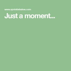 the words just a moment are written in white on a green background with an image of a