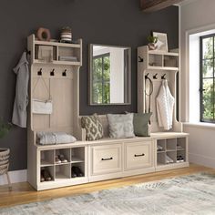 a room filled with lots of wooden furniture and mirrors on the wall next to a window