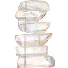 four crystal rocks stacked on top of each other in front of a white background,