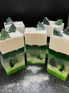 soap bars with green and white frosting sitting on a counter top next to each other