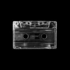 an audio cassette tape recorder on a black background