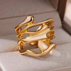 Introducing our 18K Gold Plated Statement Hug Ring - a blend of luxury and practicality. This ring boasts a unique ocean wave hugging design in radiant 18K gold, making a bold statement for any occasion.  Waterproof and perfect for everyday wear, its durability ensures you can confidently embrace any adventure. With a snug fit and sleek finish, this ring seamlessly combines comfort and style, making it your go-to accessory for expressing individuality and elevating everyday elegance. DETAILS: -W Hot Necklaces, Finger Jewelry, Angel Feathers, Ring Female, Bracelet Viking, Gold Color Ring, Mens Engagement, Wide Rings, Color Dorado