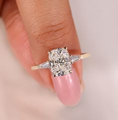 Cushion Cut Three Stone Engagement Ring - Side Stone Tapered Baguette - Lab Grown Diamond Ring for Proposal - Elongated Cushion Diamond Ring - Anniversary Rings for Her - Claw Prongs - Long Cushion Cut lab Created Diamond Ring - Handmade Jewelry by Avideri - Labor Day Sale ● 𝗗𝗶𝗮𝗺𝗼𝗻𝗱 𝗗𝗲𝘁𝗮𝗶𝗹𝘀 ↦ Type: Lab Grown Diamond ↦ Shape: Elongated Cushion Cut ↦ Color: E ↦ Clarity: VS ↦ Measurement:  1.00 CT: 6.80 X 5.25 X 3.60 MM 1.50 CT: 7.57 X 5.82 X 4.00 MM 2.00 CT: 8.70 X 6.80 X 4.30 MM ● ? Lab Created Diamond Rings, Cushion Diamond Ring, Anniversary Rings For Her, Long Cushion, Elongated Cushion Cut, Elongated Cushion, Three Stone Engagement Ring, Beautiful Diamond Rings, Claw Prong