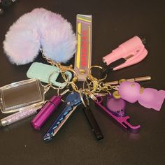 a bunch of items that are sitting on a table with one keychain and the other