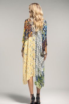 The colors on this kimono are just goregous! This will work with so much in your wardrobe! - 100% Viscose - 37.5"x39" - One size fits all V-neck Patterned Kimono For Festival, Flowy Multicolor Tunic Cover-up, Oversized Spring Tunic Cover-up, Flowy Long Sleeve Spring Kimono, Rayon Kimono For Fall Vacation, Fall Vacation Rayon Kimono, Fall Rayon Kimono With Kimono Sleeves, Flowy Long Sleeve Kimono For Fall, Bohemian Multicolor Patterned Kimono