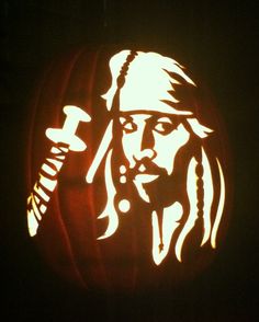 a pumpkin carved to look like captain jack sparrow