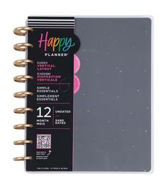 a spiral notebook with the words happy planner written on it