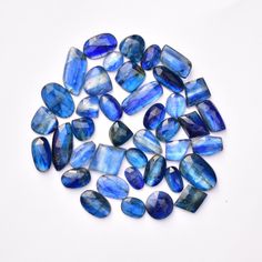 blue and white glass beads on a white surface