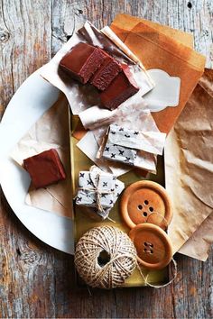 a plate topped with lots of different types of food on top of a wooden table