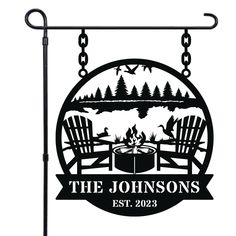 a sign that says the johnsons with two chairs and a campfire on it