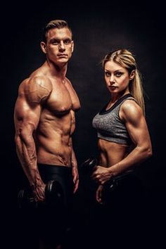 a muscular man and woman posing for the camera