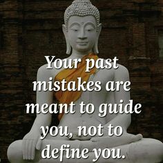 a buddha statue sitting in front of a brick wall with the words your past mistakes are meant to guide you, not to define you