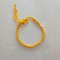 Handmade Yellow String Bracelet Adjustable Yellow Bracelets As Gift, Adjustable Yellow Bracelets For Gifts, Adjustable Yellow Braided Bracelets As Gift, Yellow Beaded Bracelets With Sliding Knot As Gift, Yellow Beaded Bracelets With Sliding Knot For Gifts, Yellow Beaded Bracelet With Sliding Knot As Gift, Adjustable Yellow Bracelets For Friendship, Adjustable Yellow Bracelet For Friendship, Handmade Adjustable Yellow Bracelet