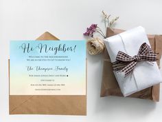 a brown envelope with a bow and some flowers on it next to a card that says, he might be neighbor