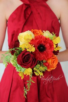 a woman in a red dress holding a bouquet of flowers