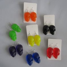 These skulls are made to order from resin mixed with glitter, and attached to 925 sterling silver dangles. Each skull is approximately 4.5cm long.  As this is a handmade product, slight colour and size variations may occur.  If you would like to request a specific colour not offered, please send me a message and I will make this for you. Rubber earring backs will be provided with each pair. Your earrings will be dispatched within 1-2 days and sent via Royal Mail 1st Class.  Due to hygiene reasons, returns will be accepted but only if the product is faulty.  Please get in touch if you have any questions or particular requirements and I'll do my best to help. Any feedback is welcome in order to help my small business grow.  *New products added weekly, please follow the store and check back r Halloween Resin Jewelry Gift, Halloween Gift Resin Jewelry, Novelty Party Jewelry Made Of Plastic, Novelty Plastic Party Jewelry, Glitter Skull, Weird Jewelry, Funny Earrings, Statement Jewellery, Halloween Spooky