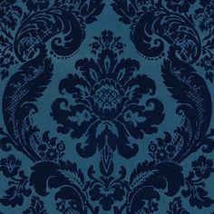 a blue and black wallpaper with an ornate design on it's side,