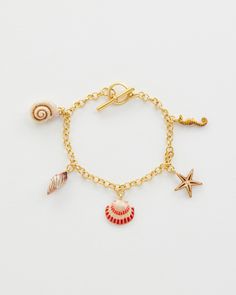 Key Features:



Whispering Sands Inspiration: Embrace the essence of our Whispering Sands collection with the Hand Painted Shell Charm Bracelet, evoking memories of sandy shores and sunlit days by the ocean.


Exquisite Craftsmanship: Delicately hand-painted shell charms crafted from 22k worn-gold plated zinc alloy, complemented by a matching chain of 22k worn-gold plated brass.


Perfect Length: 19cm bracelet adorned with five charms, each measuring 1.5cm in diameter, ensuring a graceful fi Swan Jewelry, Gold Arm Band, Charm Bracelet Gold, Sand Collection, Luxury Christmas Gifts, Animal Bracelet, Talisman Necklace, Shell Collection, Painted Shells