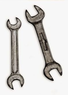 two wrenches are shown on a white background