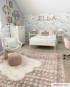 a bedroom decorated in pastel colors with floral wallpaper and white furniture, including a hammock chair