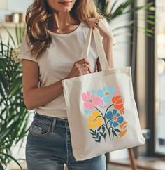 This 100% cotton bag comes in one size - 15" x 16"- perfect for everyday wear. While the canvas material will show off your designs in great colors, it's durable and will last for years. The bag features 20" handles (made from the same canvas), making it easy to carry even with a week's worth of shopping. .: 100% cotton canvas .: Available in natural and black colors .: Heavy fabric (12 oz/yd² (406.9 g/m .: Sewn-in label Flower Shaped Cotton Shoulder Bag For Everyday Use, Everyday Cotton Shoulder Bag With Floral Print, Everyday White Floral Print Canvas Bag, Floral Print Cotton Bags For Gifts, White Floral Cotton Canvas Bag, Floral Print Cotton Bag For Gift, Cotton Floral Print Bag For Gifts, White Cotton Canvas Bag With Floral Print, Floral Print Cotton Shoulder Bag