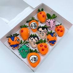 a box filled with lots of decorated cookies