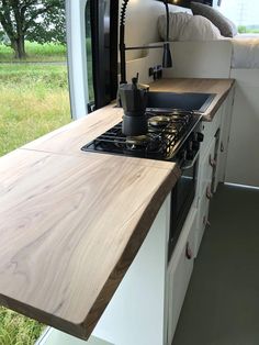 the kitchen counter is made out of wood