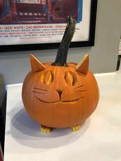 a pumpkin with a cat's face carved into it