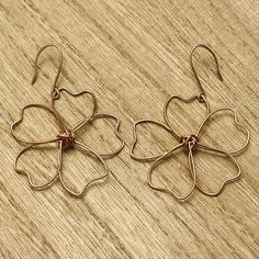 Handcrafted using high-quality copper and silver wire. The copper earring hooks are handmade.  Hypoallergenic and nickel-free! Dimensions: 1.5" diameter flower, 2" total drop length. These are delicate, very light-weight, and are sealed with a protective coating for longevity. It is recommended that in order to preserve the life of these earrings, even when sealed, please remove them before engaging in water or strenuous activities (sports, exercising, swimming, etc.). Rose Gold Copper Wire Earrings As Gift, Rose Gold Flower Shaped Earrings, Silver Flower Earrings With Ear Wire, Handmade Gold Flower Earrings In Copper, Copper Drop Flower Earrings As Gift, Nickel Free Rose Gold Copper Wire Earrings, Copper Drop Flower Earrings With Ear Wire, Copper Drop Earrings With Flower And Ear Wire, Adjustable Wire Wrapped Flower Earrings