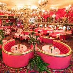 the interior of a fancy restaurant decorated for valentine's day